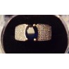 WHITE GOLD RING - 18 CARATS - DECORATED WITH A CENTRAL SAPPHIRE AND 100 GLOSSES OF 1 CARAT EACH - SIZE 56